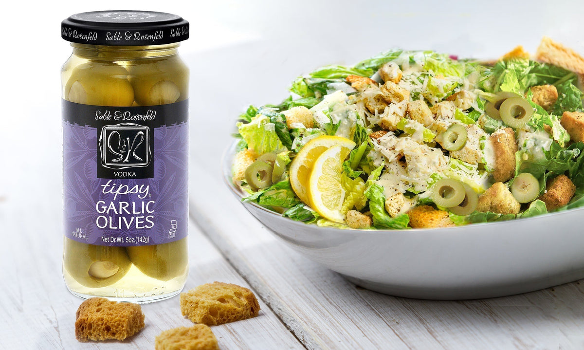 Caesar salad with Vodka Garlic Tipsy Olives