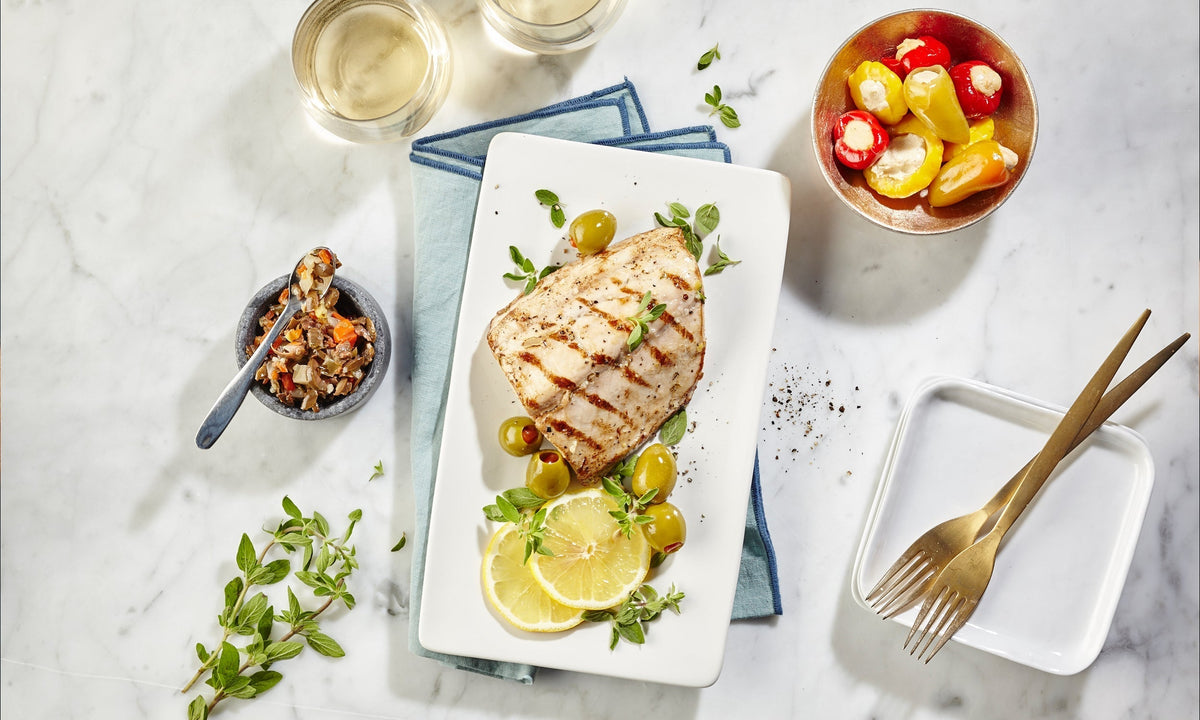 Grilled cobia topped with Olive Bruschetta
