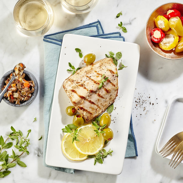 Grilled cobia topped with Olive Bruschetta