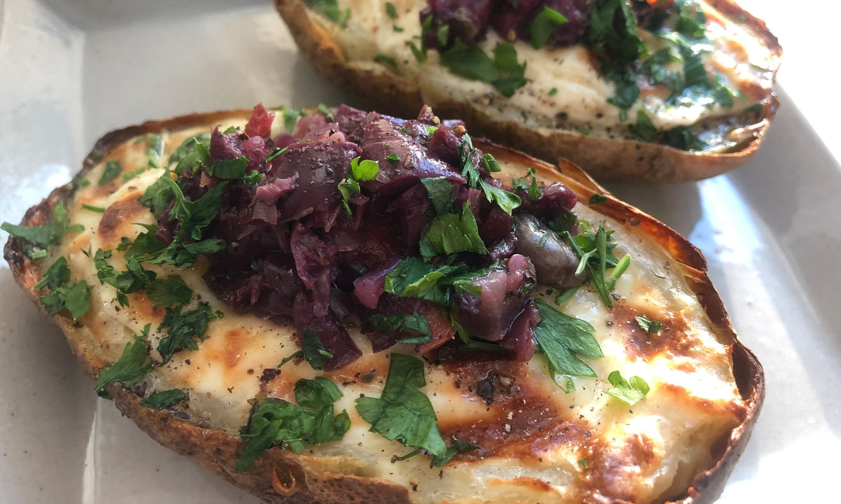 Twice-baked potatoes topped with Spicy Olive Bruschetta