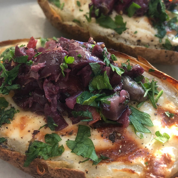 Twice-baked potatoes topped with Spicy Olive Bruschetta